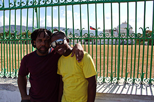 Victor Wooten and Bekenson Pierre in Front of Collapsed Presidential Palace Small